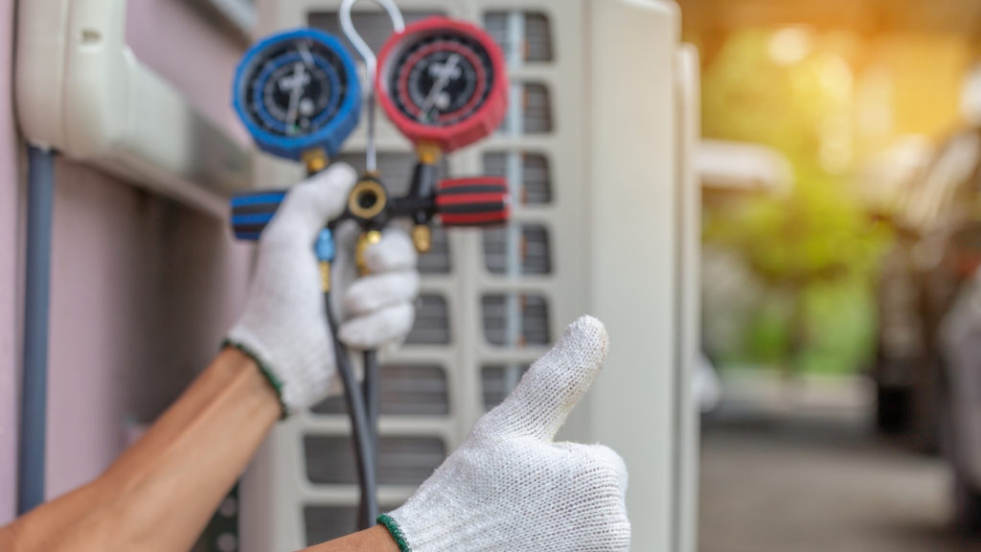 Close up of Air Conditioning Repair, repairman on the floor fixing air conditioning system